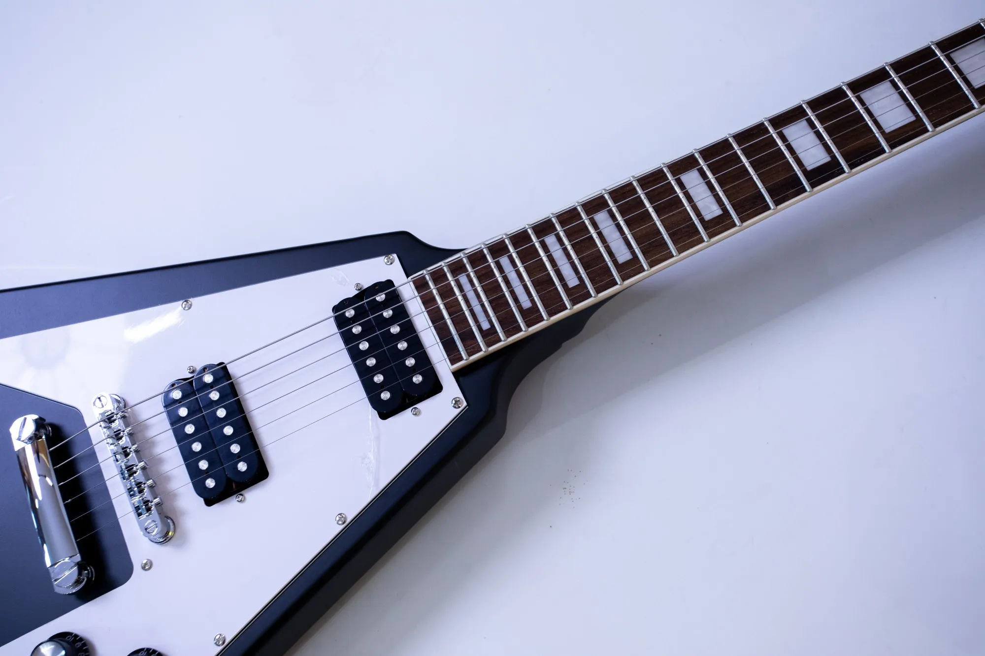 Customizable, factory direct, matte black 22-fret Okouman electric guitar, rosewood fingerboard, in stock.