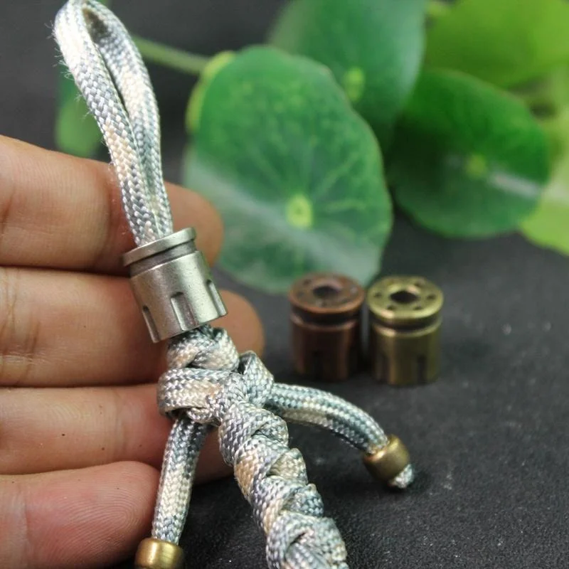 مسدس ماغنوم رصاصة مجلة شكل لتقوم بها بنفسك النحاس سكين الخرز Paracord مظلة حبل سوار في الهواء الطلق EDC حبة الحبل اكسسوارات