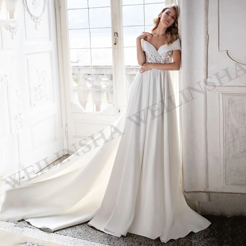 Vestido de novia de satén clásico con hombros descubiertos, cuello en V, apliques transparentes de flores, línea A, tren de corte, vestido de novia con bolsillos