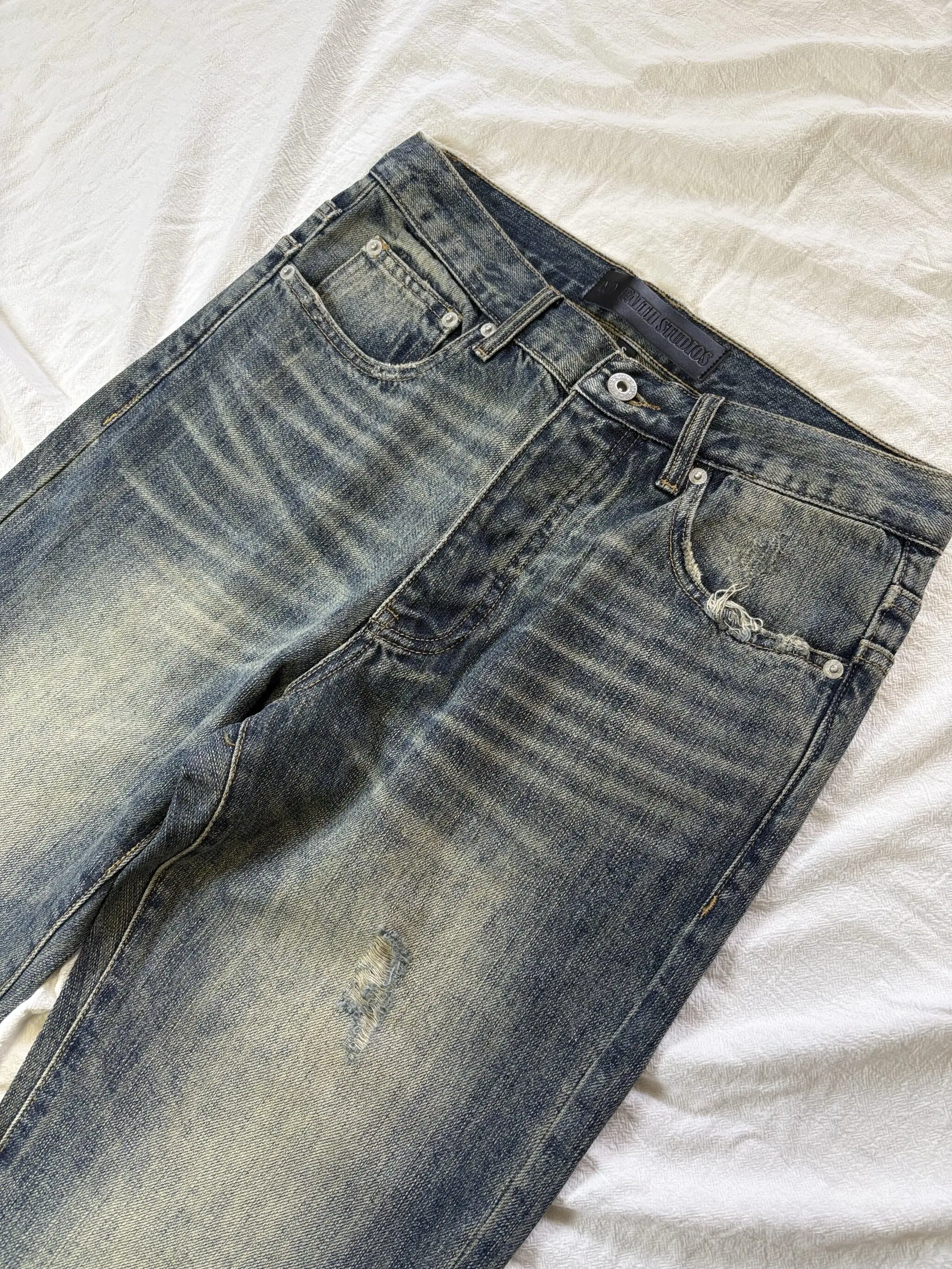 No faith studios sun fading washed old hand cut holes heavy industry patch straight jeans