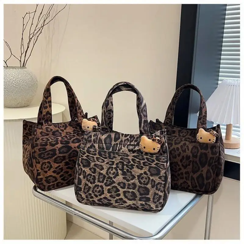 

Hello Kitty Student Canvas Lunch Bag Sanrio Girl Cartoon Kawaii Leopard Pattern Handbag Large Capacity Storage Bag Portable New