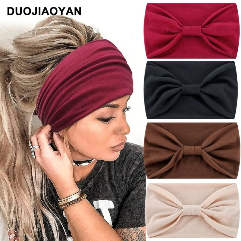 

Hot-Selling New Arrival Solid Color Wide Brim Knot In The Middle Stretch Sports Yoga Cross Hair Band Wholesale