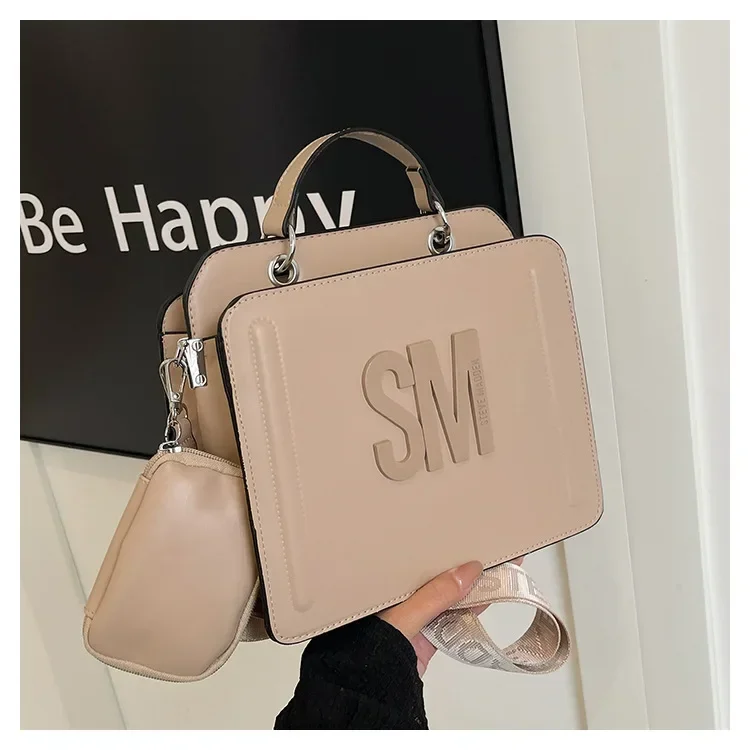 

2025 Модная сумка-шоппер большой вместимости — элегантная однотонная сумка-тоут с роскошным буквенным логотипом и дизайном для поездок на работу