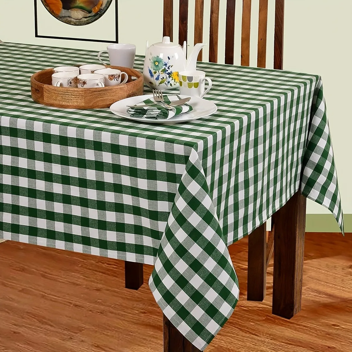 One tablecloth in a classic green and white check pattern, with a country style design.