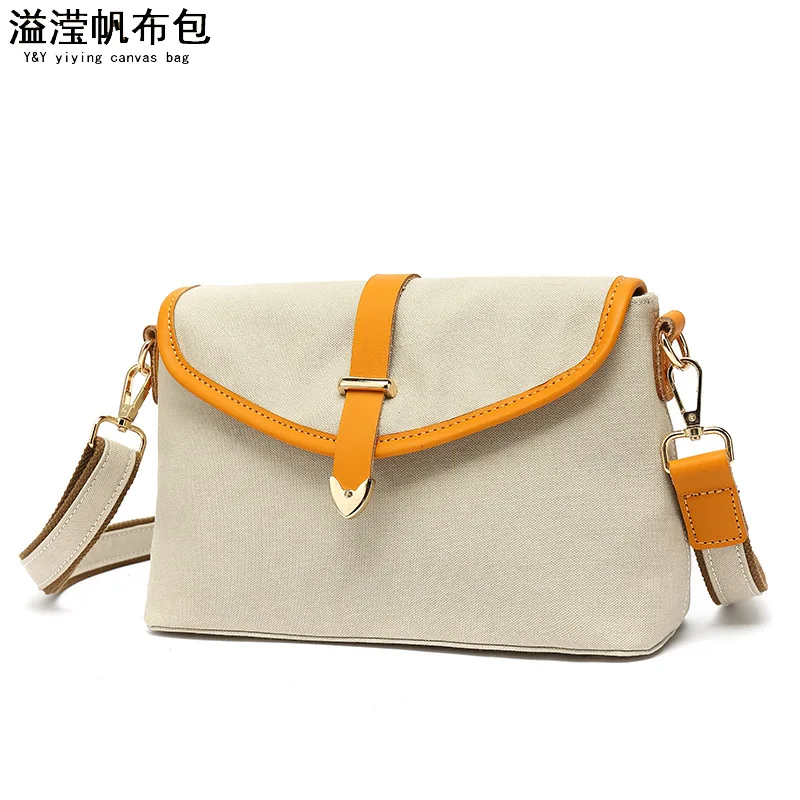 

Casual women's portable waterproof canvas oblique span bag with first-layer leather solid color shoulder bag fashionable, simple
