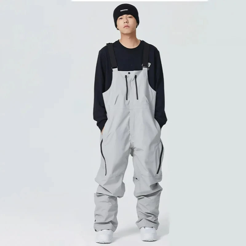 

Новые женские и мужские термоветрозащитные водонепроницаемые дышащие лыжные штаны, зимние спортивные лыжные комбинезоны на открытом воздухе, брюки с ремешком для сноуборда