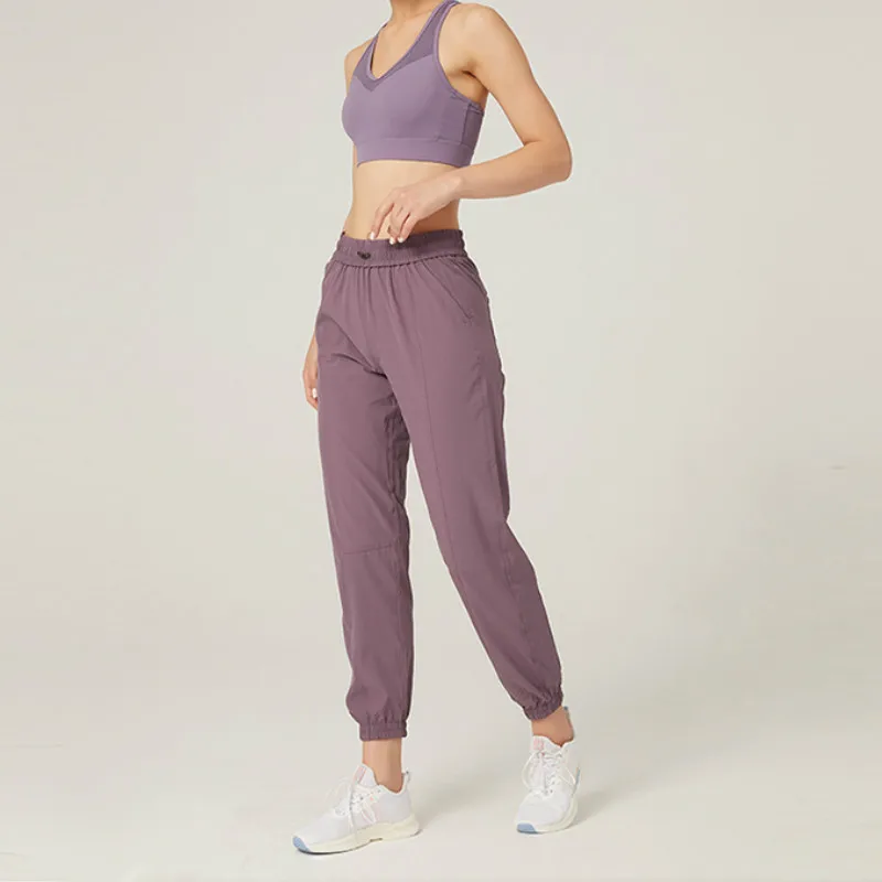 Spodnie do joggingu fitness do biegania ze sznurkiem nadają się do szybkoschnących i oddychających pasów fitness dla kobiet, a boczne kieszenie
