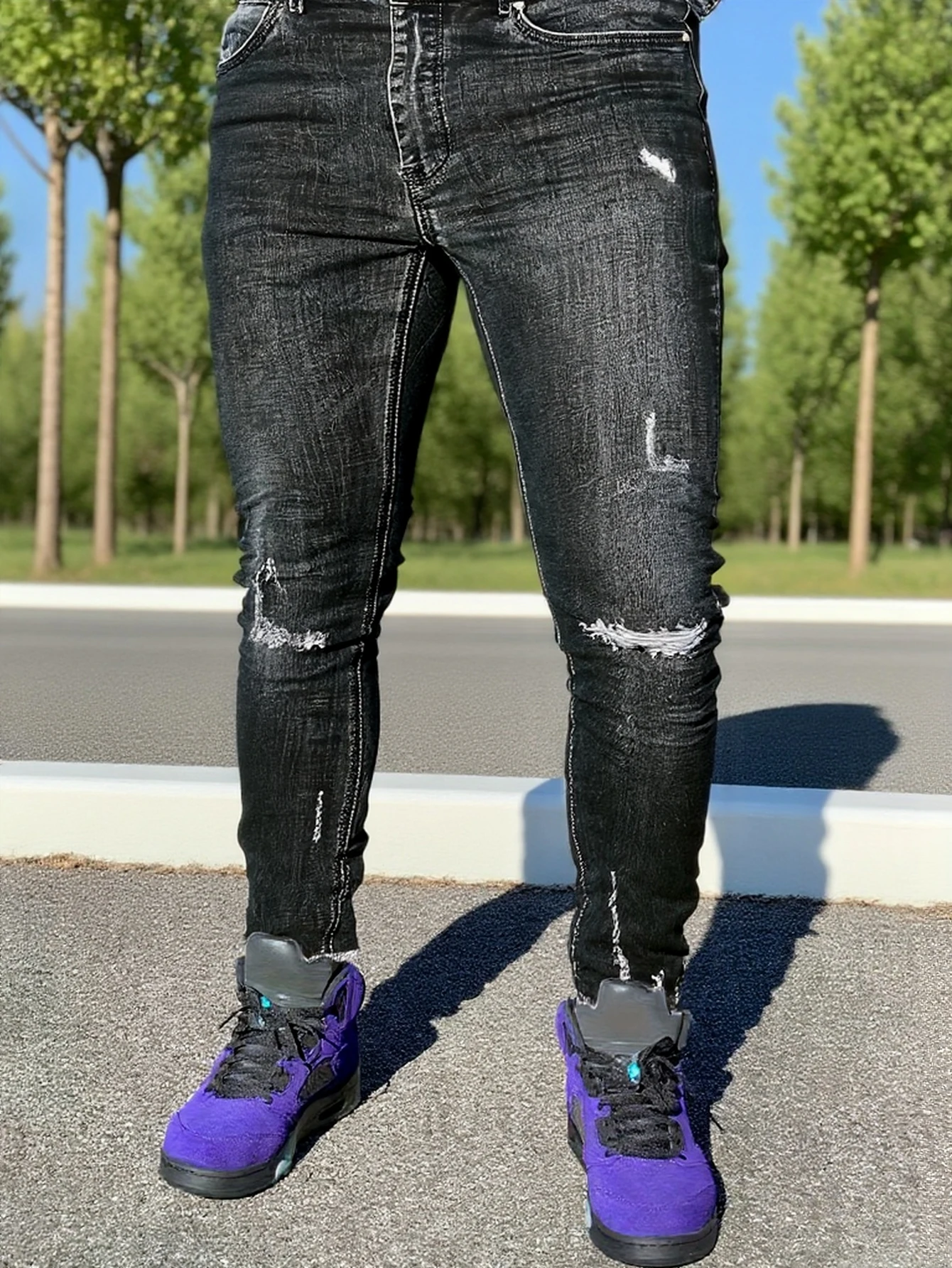 

Men's black distressed skinny jeans, featuring a unique worn-out design that fits the body shape perfectly, making it easy to cr