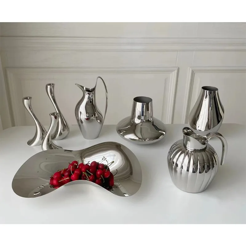 

Простая европейская тарелка для фруктов из нержавеющей стали, нестандартной формы, с изящным дизайном, для демонстрационных комнат и домашнего использования в гостиной.