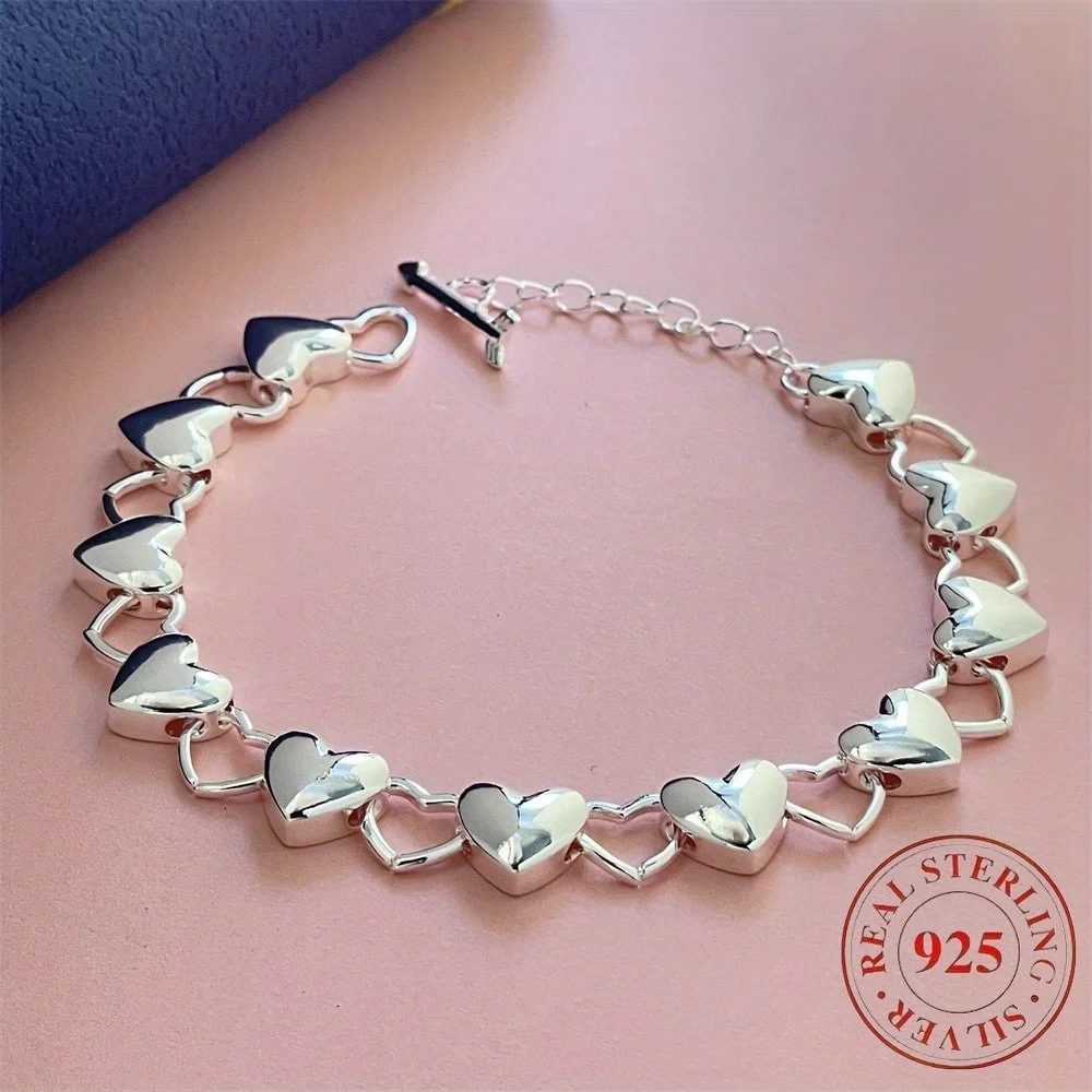 Exquisite 925 Sterling Silver Heart-Shaped Bracelet: A Stylish Engagement Jewelry Accessory and Charming Gift for Women.