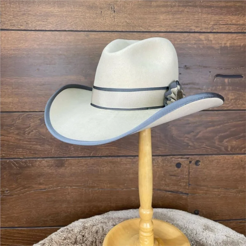 A white felt top hat with contrasting color ribbon metal label and wide-brimmed