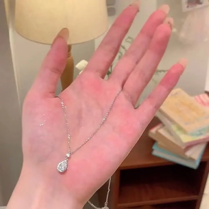 925 Sterling Silver Water Drop Pendant Necklace for Women Featuring Diamond Accents Cross Chain Design Elegant Clavicle Jewelry