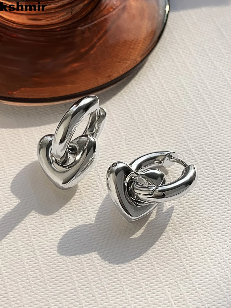 

Retro European and American INS niche high-grade heart earrings women two earrings buckle golden simple earrings