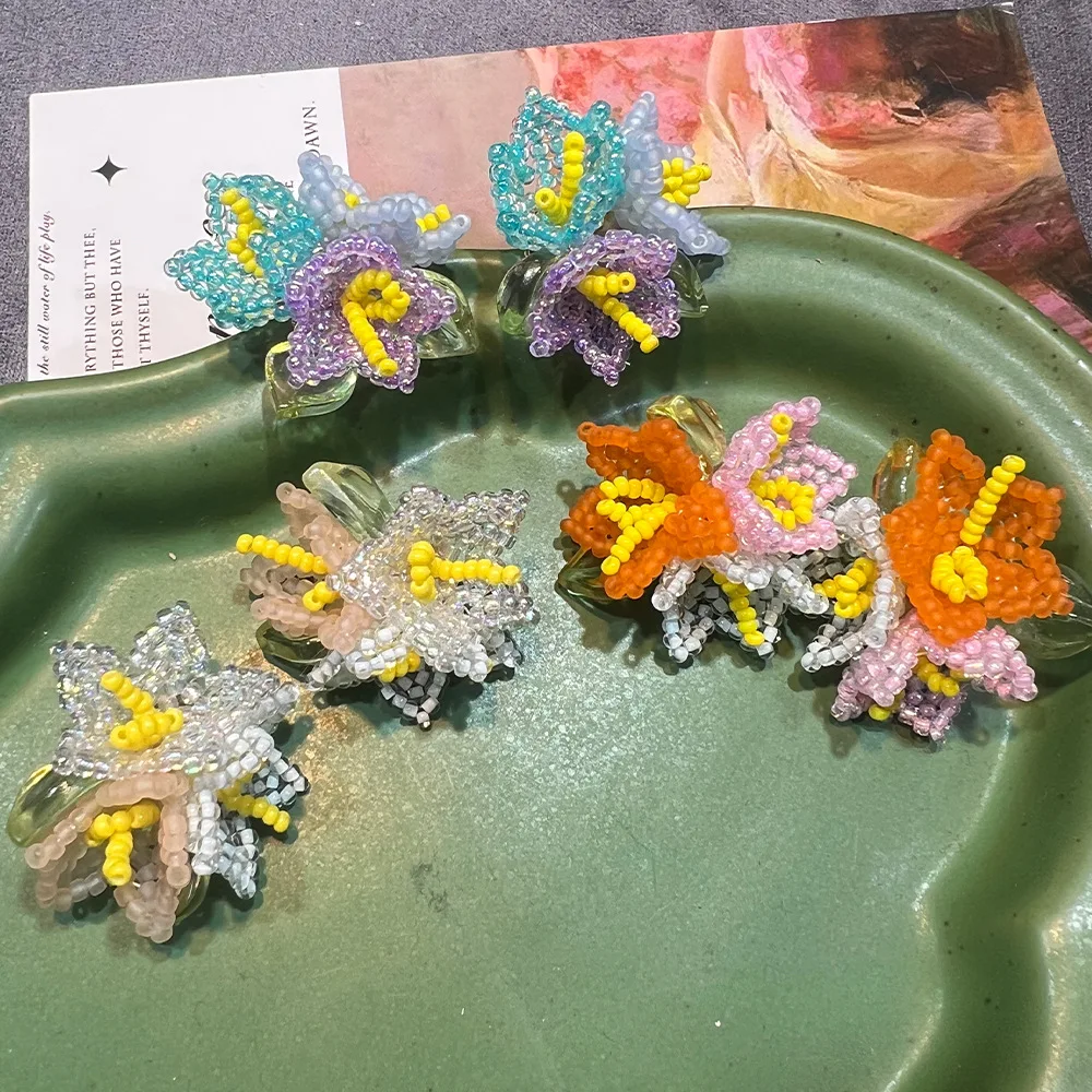 S925 gold-plated hand-woven over-limited spring and summer new flower earrings, niche design new versatile earrings