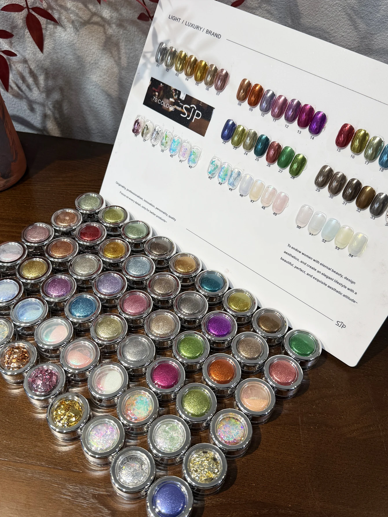 

54 premium nail polish colors, including Magic Mirror Pink, Opal Pink, and Moonlight Pink, with a storage box.