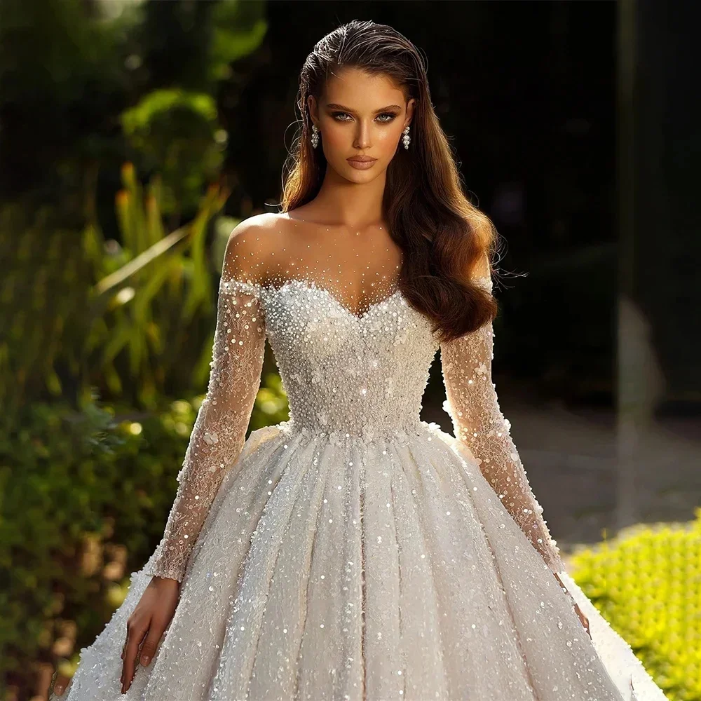 

Luxurious & Sparkling Wedding Gown — Sheer Round Neck, Long Sleeve, Beaded & Sequined, Open-Back Bridal Dress