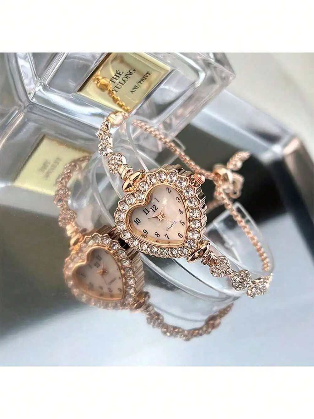 

Часы из розового золота с кварцевым механизмом, украшенные кристаллами в форме сердца, с регулируемым браслетом-цепочкой