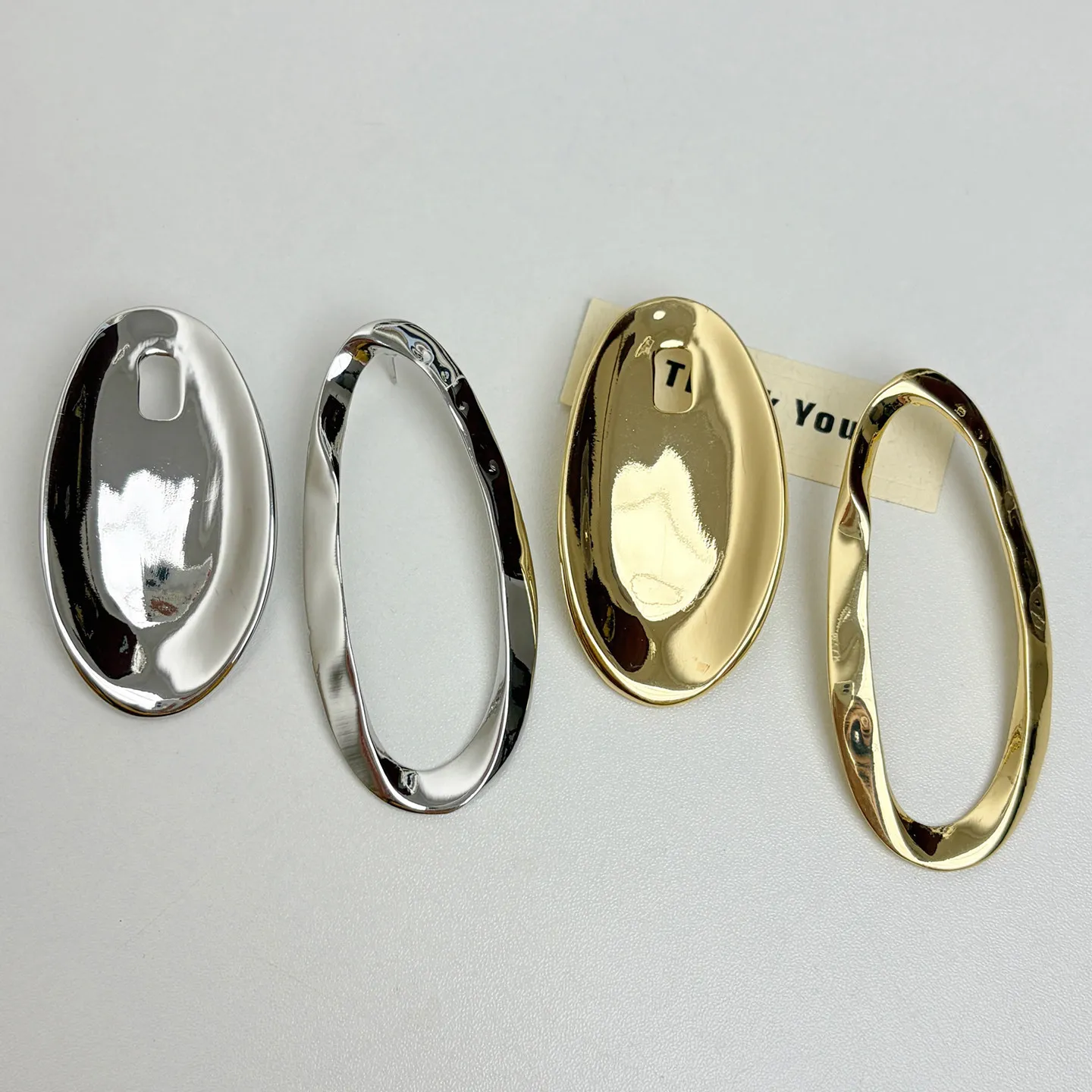 European and American heavy industry exaggerated asymmetrical oval circle earrings for women's minimalist metal cold wind temper