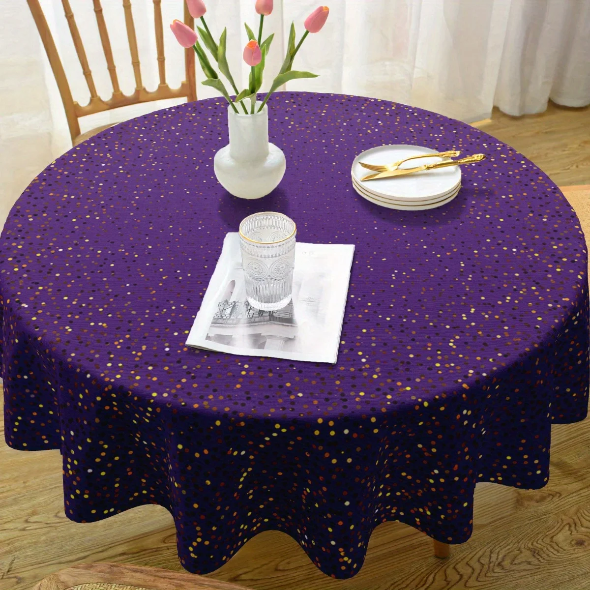 One elegant purple polyester tablecloth with golden dots - durable.