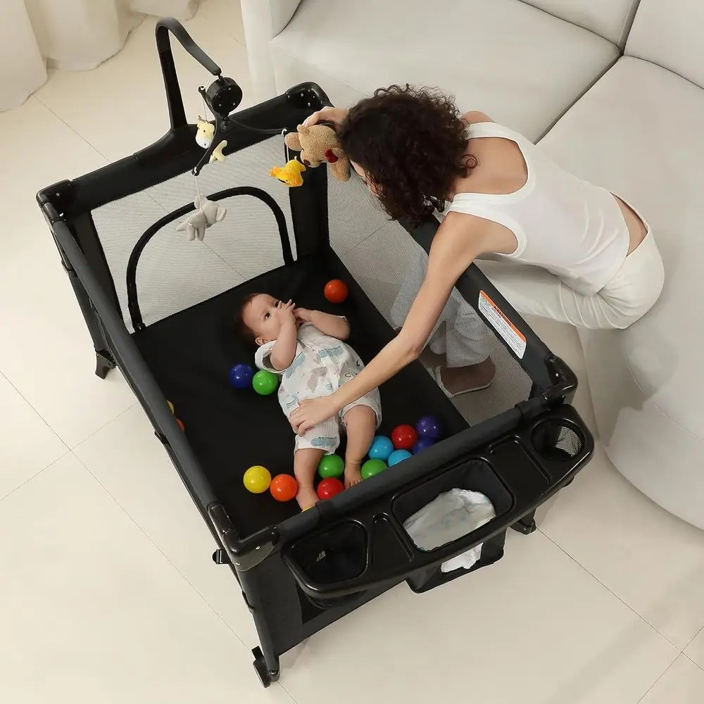 All-in-One Portable Playard, Bedside Bassinet Sleeper, Changing Table Playpen for Newborns to Toddlers (Black)