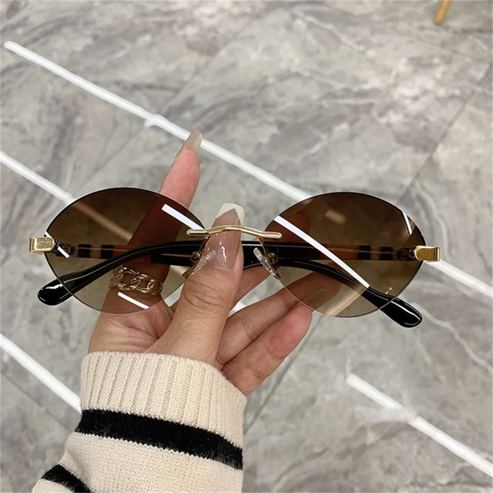 Retro Oval Frame Sunglasses Are Fashionable And Frameless Showcasing A Personalized Trend Suitable For Street Concave Styling