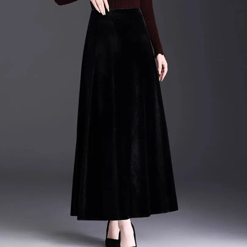 تنورة عصرية جديدة باللون الذهبي المخملي بلون سادة على شكل حرف a للنساء تنورة خريفية بقصة ضيقة بخصر عالٍ