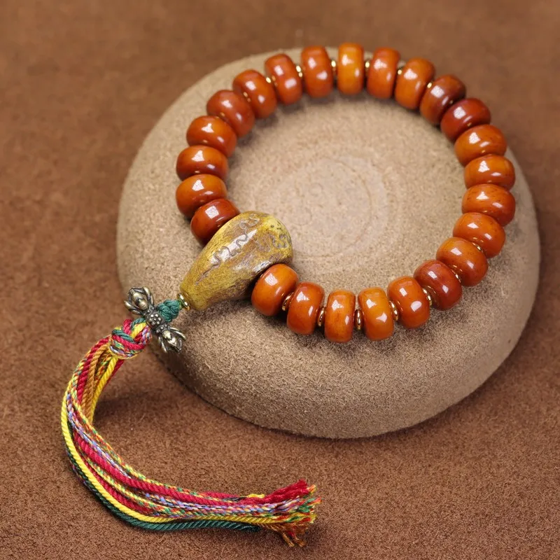 Tibetan-style natural cow bracelet with aged yak barrel and patinaed bone beads