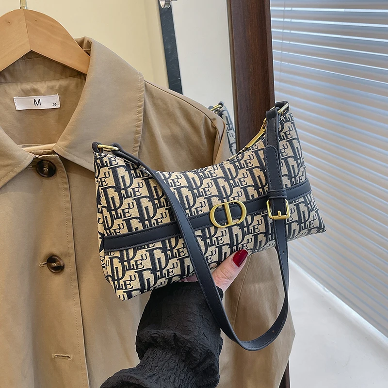 2025年新版 エレガントなトップハンドルバッグ チェーンディテール付き プレミアムスムースレザー デイトゥナイト 多用途 キャリーエッセンシャル