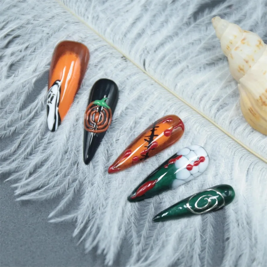 Handmade pressed fake nails, pumpkin Halloween elements, adhesive fake nails, long pointed styles, finished nail art,