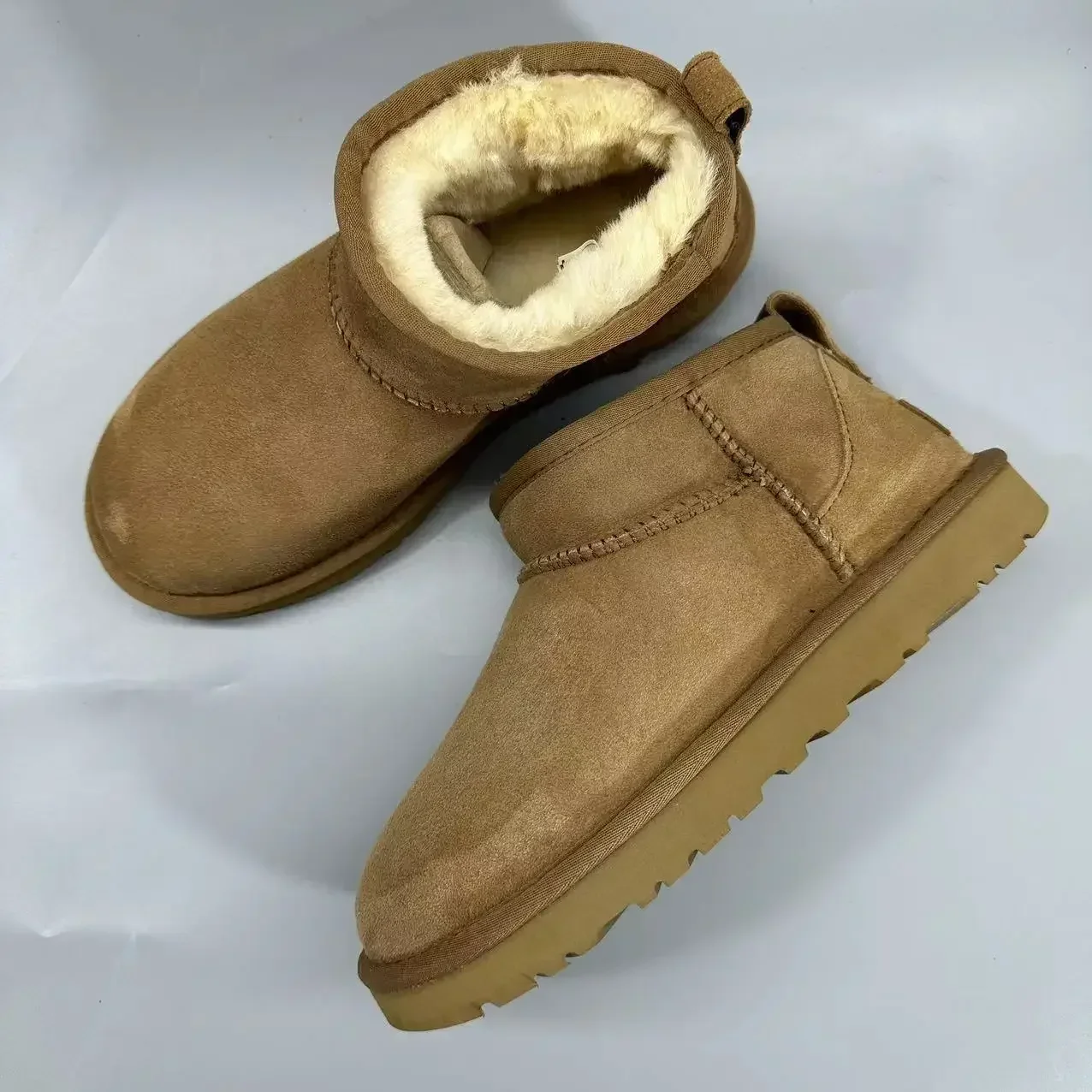 Botas curtas de lã de carneiro real para homens e mulheres, sapatos de pele quente para senhoras, botas de neve de alta qualidade inverno