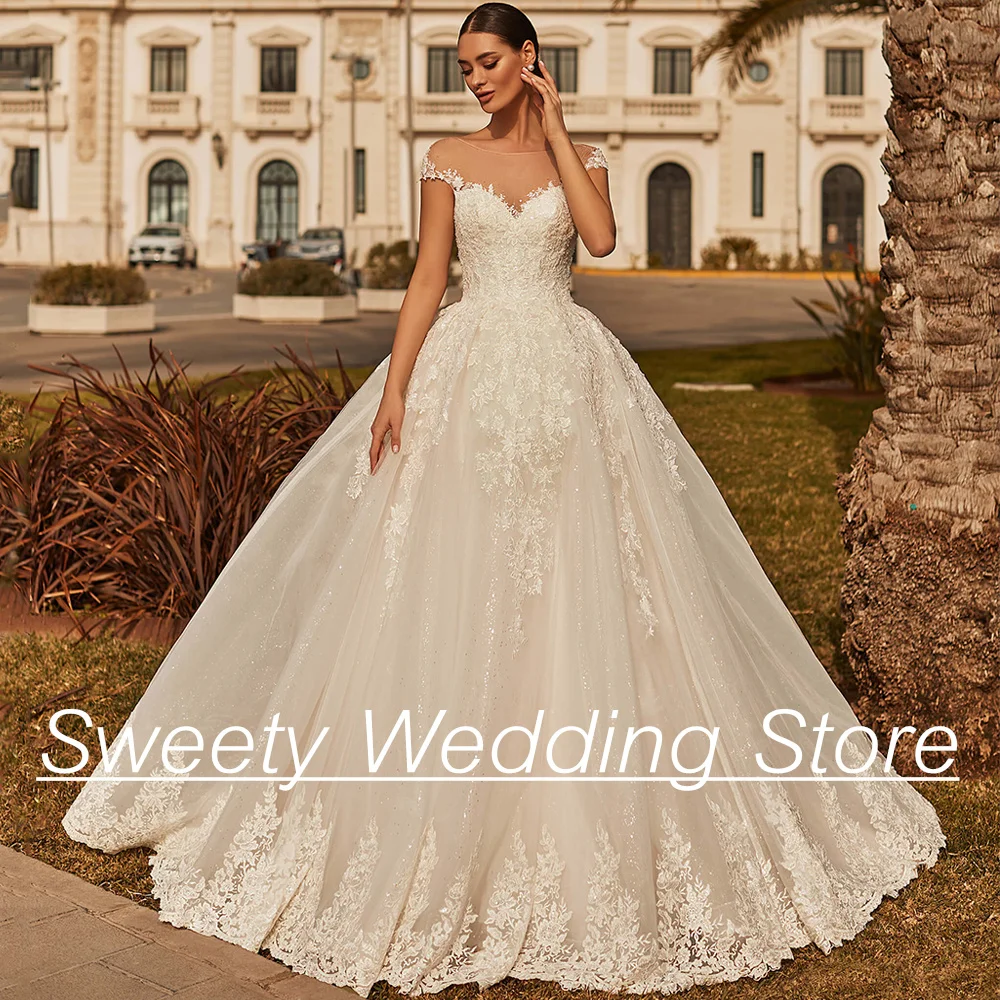 

Gorgeous Ball Gown Wedding Dresses Bridal Gown Sheer Scoop Cap Sleeve Applique Sweep Train Glitter Bride Dresses Robe Mariee