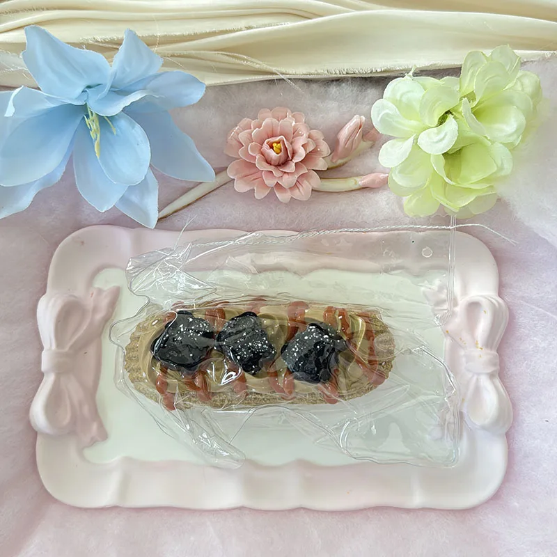 Food Grade Eclair Pastry Squishy Toy With Cream Sauce Drizzle And Black Fruit Toppings Slow Rebound Soft Squeeze Toy For Kids