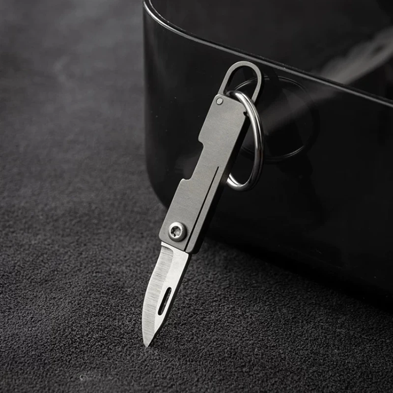 

Mini Titanium Alloy Folding Knife Outdoor Camping Portable Keychain Open Box Pocket Knife Gift EDC Tool