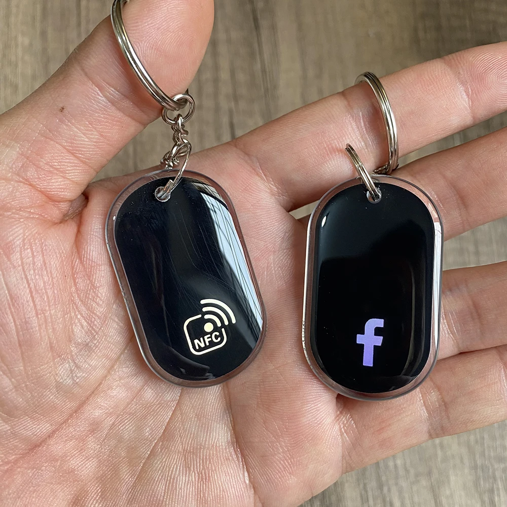 Tap to Connect us on WhatsApp Epoxy NFC Keychain Follow us on Instagram Facebook NFC Key Card