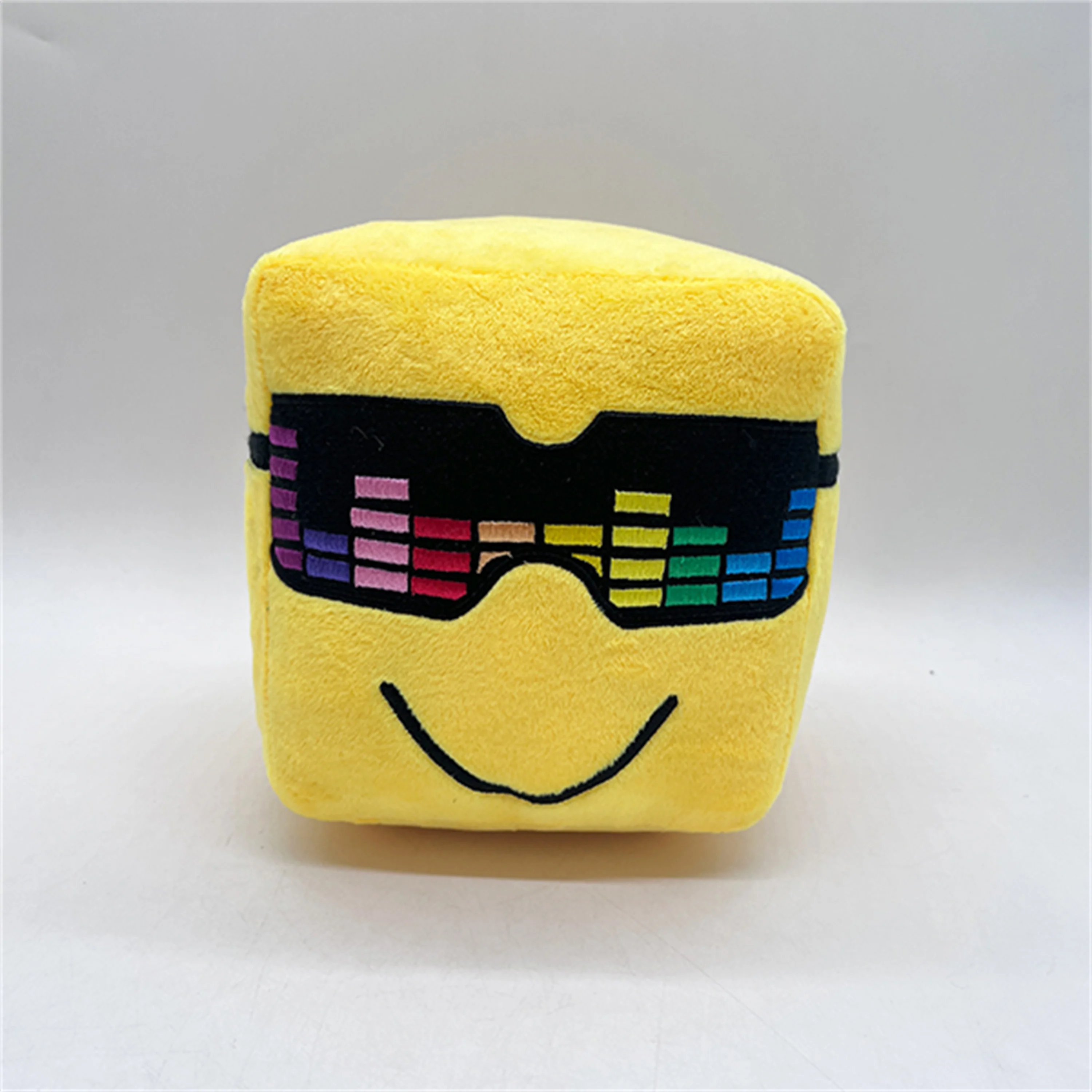 Yellow smiling small square plush doll with colored sunglasses, cute and playful pillow, trendy home decoration, soft