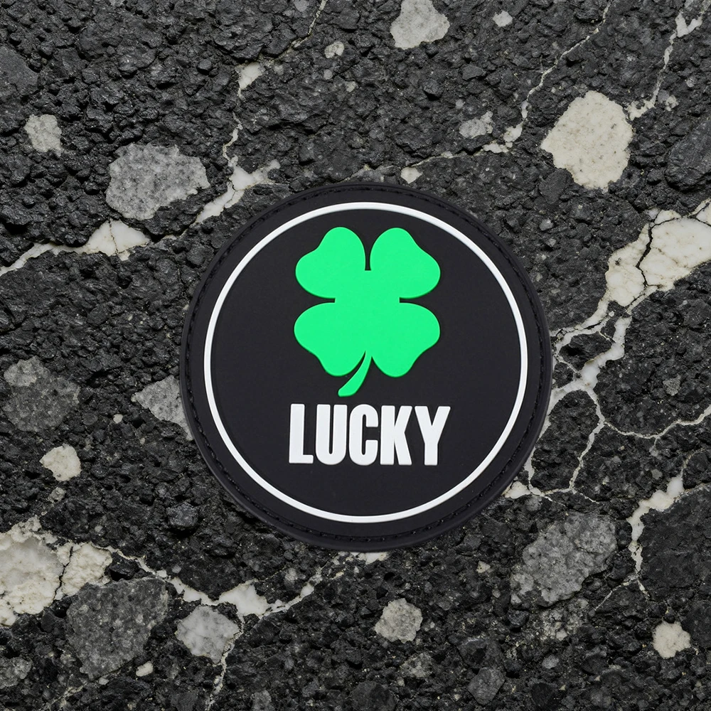 Round four-leaf clover LUCKY letter luminous decorative armband made of PVC material, comes with matching hook-and-loop accessories, storage pouch, and decorative patch stickers