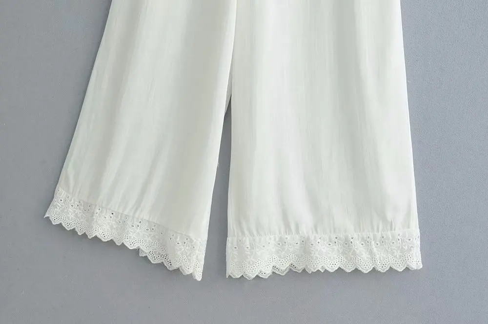 Nowa letnia moda damska 2026, casualowy kombinezon z koronkowymi wstawkami, długie spodnie z odkrytymi plecami i wycięciami.