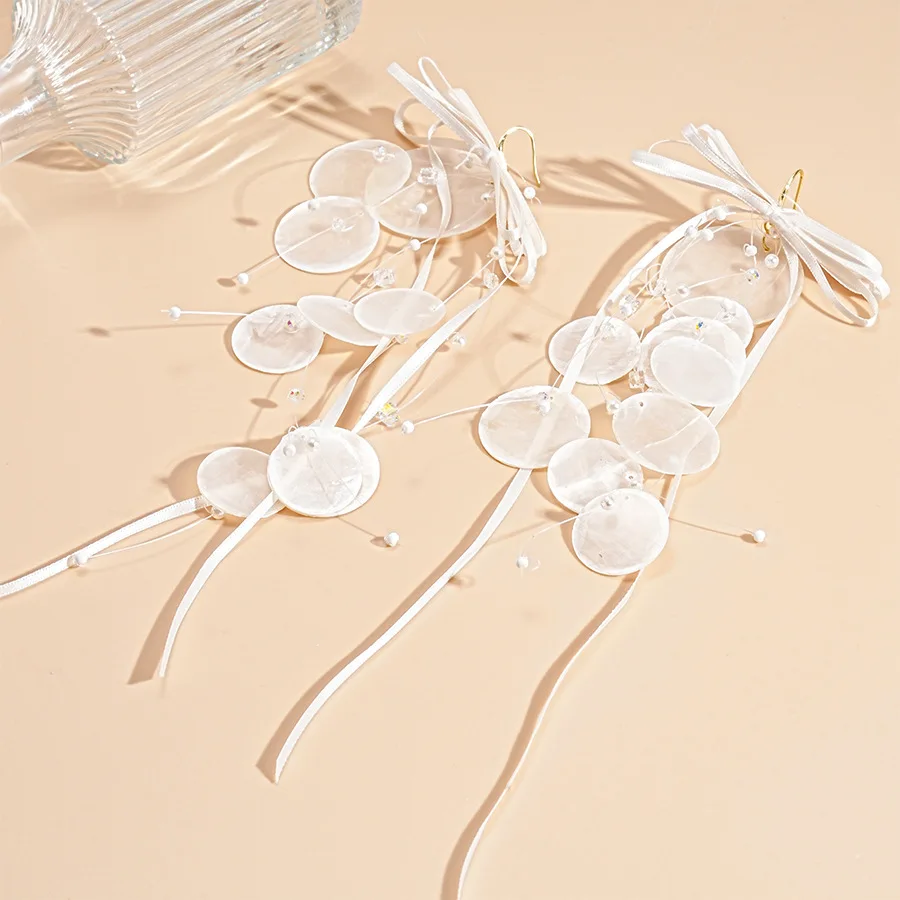 Holiday style imitation shell round bow streamer long fringed ear hook, elegant temperament high-end earrings women
