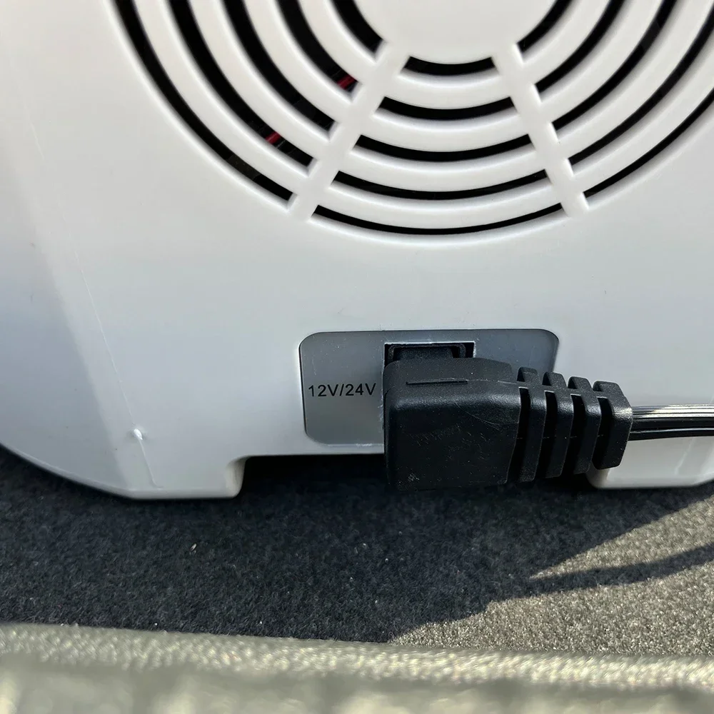 Safe lock portable car refrigerator with low noise and shoulder straps, suitable for yachts, RVs, and mini refrigerators