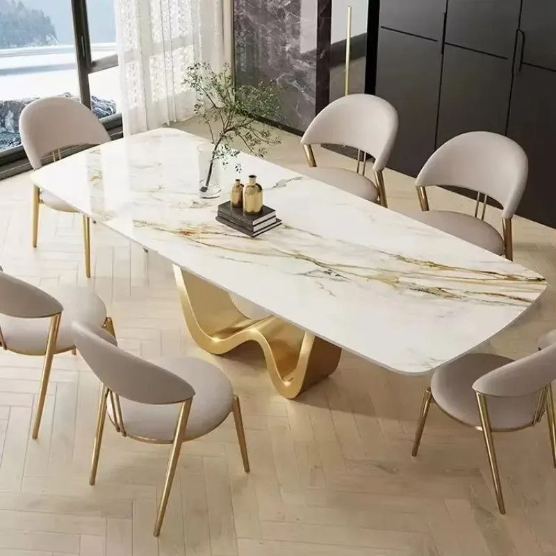 Rectangular dining table with marble-topped stainless steel frame chairs