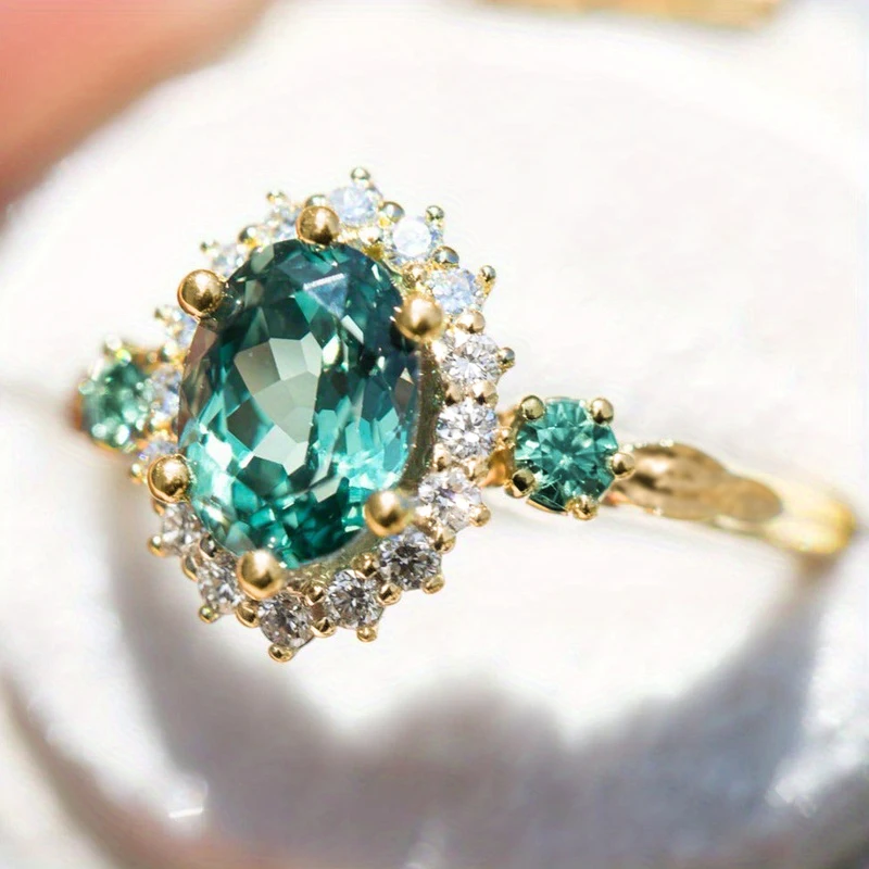 Huitan Woodland Grüner Ovaler Zirkonia-Ring für Damen, Goldfarben, Königliche Hochzeit, Verlobung, Trendy, Party, Eleganter Schmuck, Geschenk