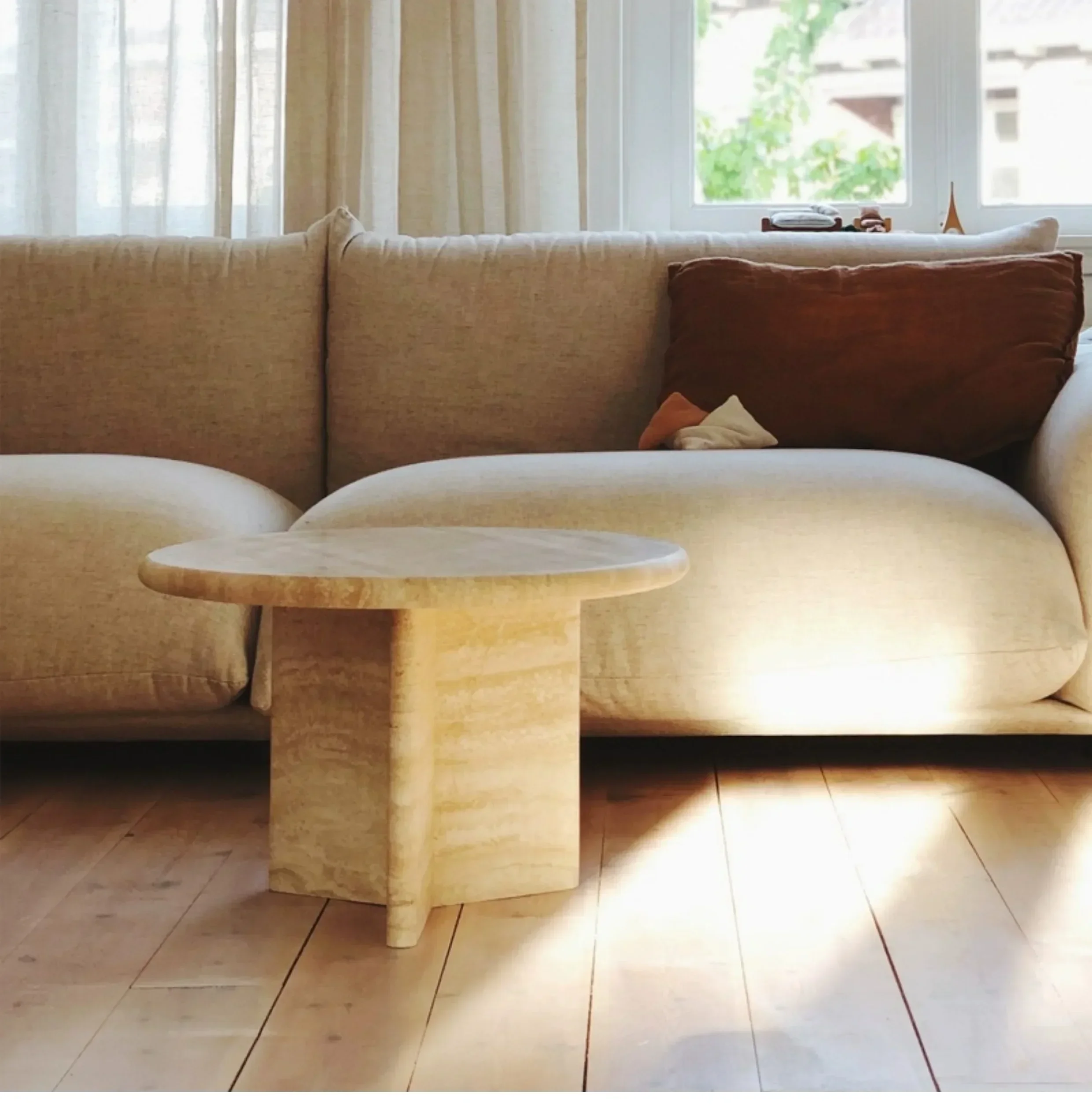 A Nordic cream wind tunnel stone coffee table round light luxury small apartment living room home creative high sense