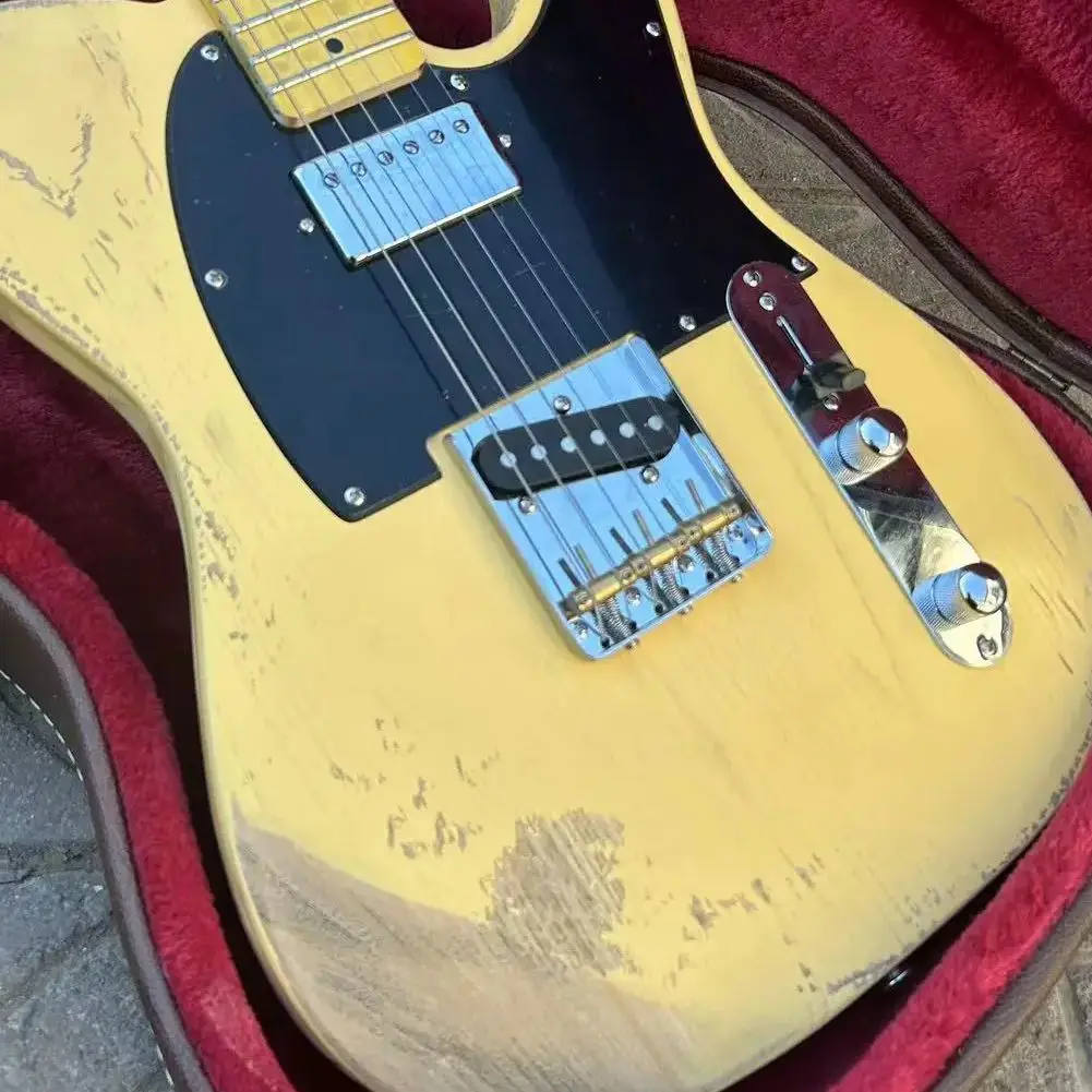 Milk yellow six-string electric guitar, basswood as old piano body, maple neck, maple fingerboard with black panel.