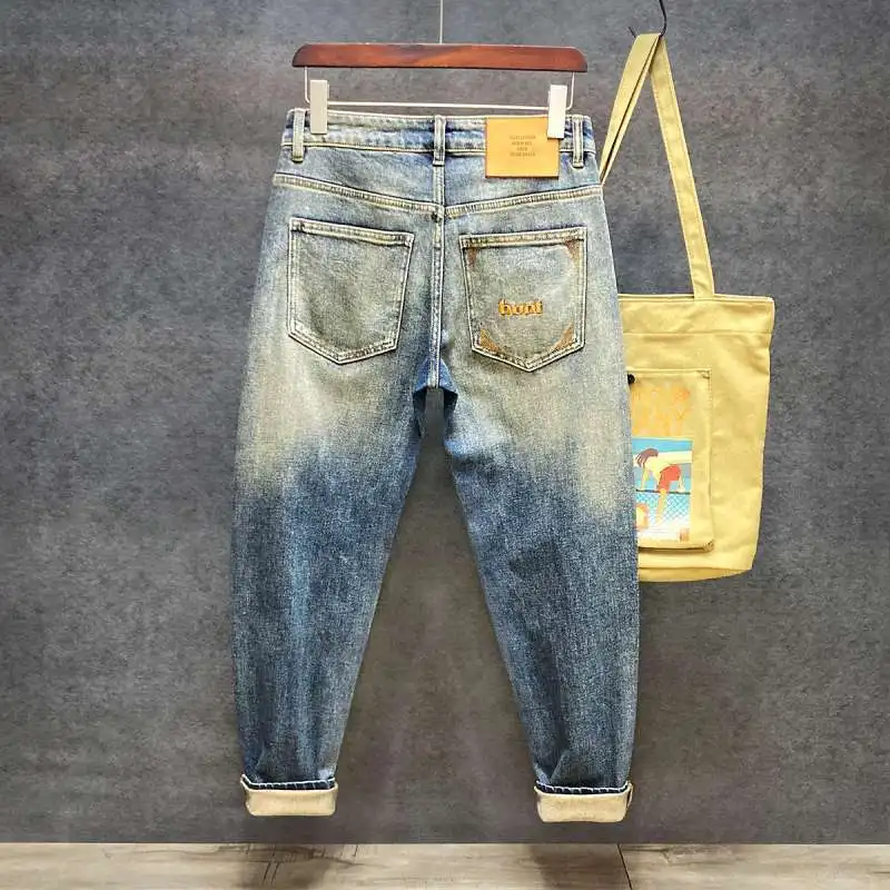 

Casual pants men's trendy brand new elastic straight loose small feet tapered denim trousers men