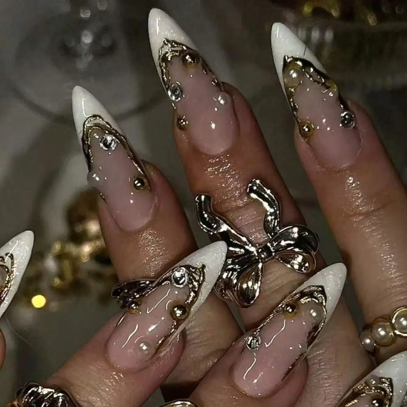 10 Pieces of Handmade Almond-Shaped Fake Nails, Featuring Irregular White French Tips Outlined with Golden 3D Lines. Hand-Painte