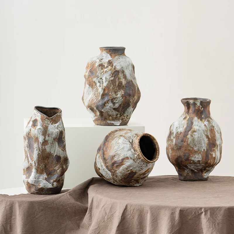 

An irregular ceramic vase with a rustic and serene style from Shu Gate, featuring a unique design for a boutique hotel. It's per
