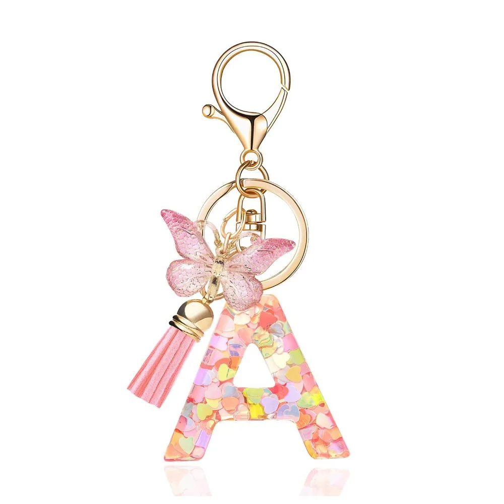 Porte-clés tendance avec initiale de l'alphabet, pompon et pendentif papillon pour sacs à main, femmes et filles