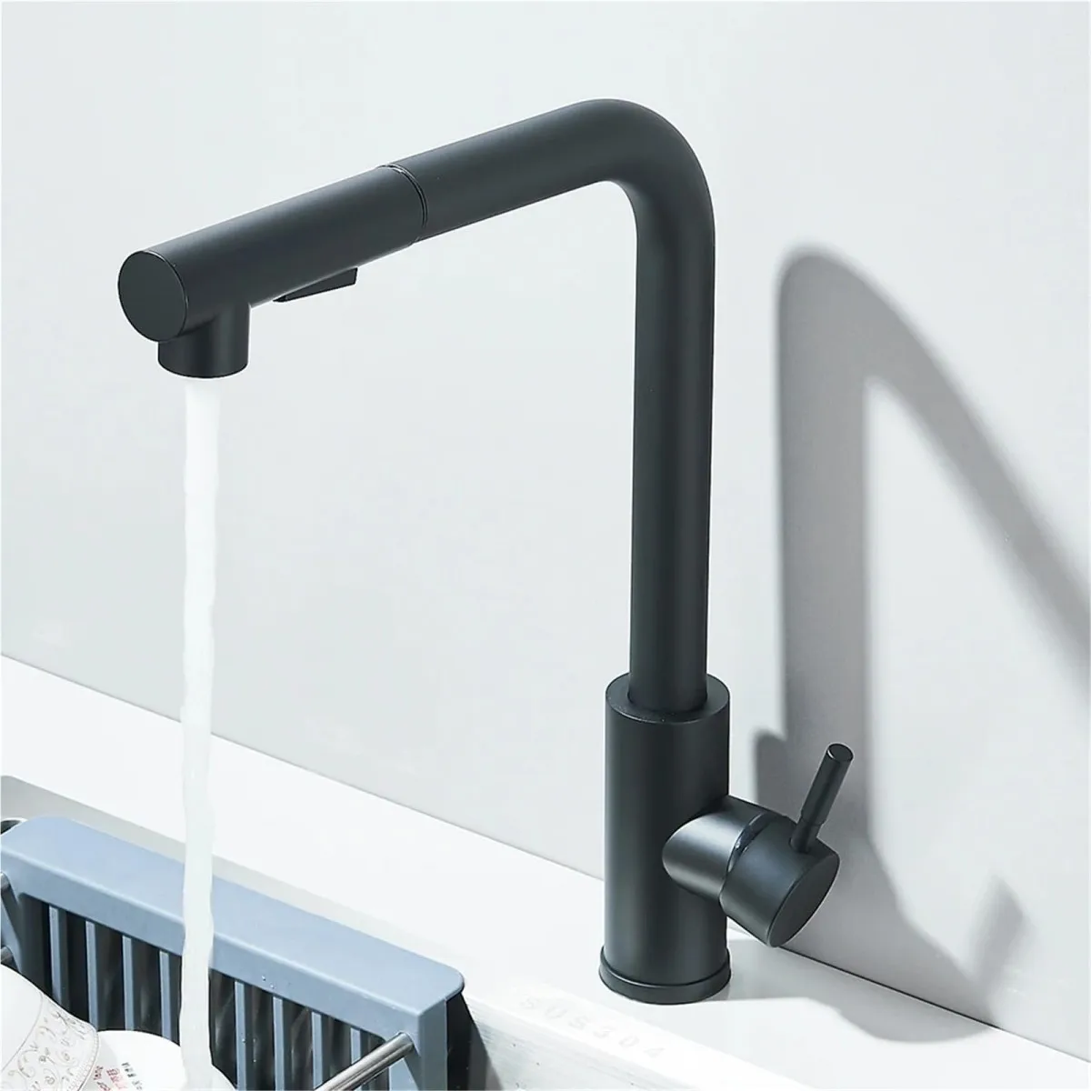 

This stainless steel pull-down faucet features a single handle and single hole design, making it suitable for kitchens and RVs.