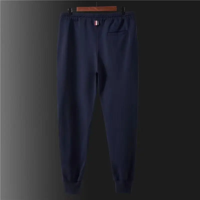 Calça de moletom clássica de tecido lateral para homens, calças esportivas casuais, calças compridas amarradas com pernas, calças cortadas da moda, outono, 2024