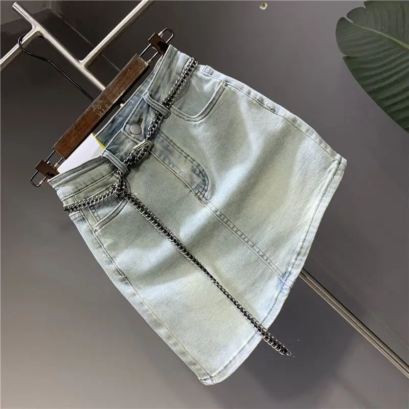 Irregular beveled elastic buttocks wrapped denim skirt for women's 2024 summer new high waisted slimming spicy girl